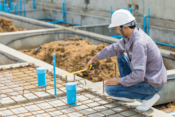 Asian construction engineer, Japanese builder worker male working inspecting footing house building.