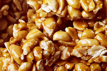 Peanut kozinaki with caramel close-up, space for text.