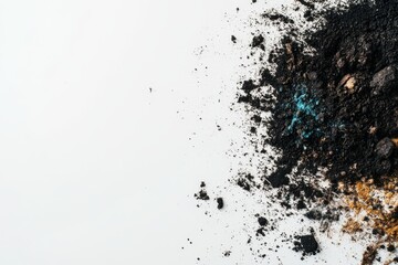 Scattered soil and earth pigments on white background