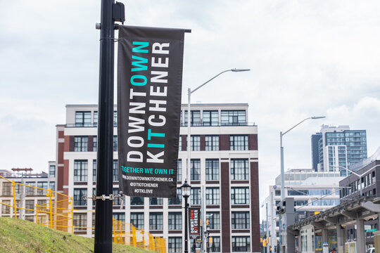 Kitchener, ON, CANADA - Aug 5 2024 : A banner for Downtown Kitchener hangs on a pole near Central Station in downtown Kitchener.