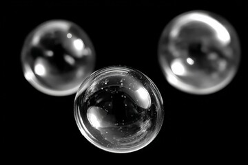 Floating translucent bubbles against a dark background create an ethereal and calming visual experience for viewers