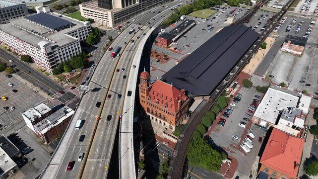 Richmond, VA downtown architecture with historic Main Street Station beside traffic passing through town on Interstate 95