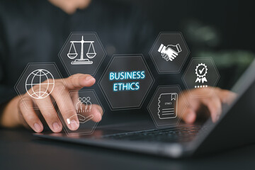 Business Ethics and Corporate Responsibility Concept. Businessman working on laptop with icons...