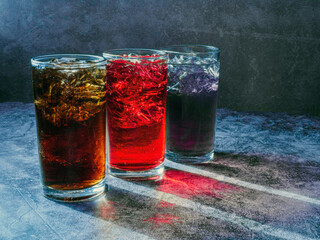 A lot of Soft drinks in colorful and flavorful glasses on the table,Glasses with sweet drinks with...
