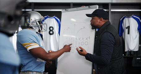 Board, writing and football with coach and team in locker room for game plan, sports strategy or...