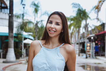 Fototapeta premium portrait of young latin woman tourist in Mexico Latin America, hispanic people female in caribbean city and tropical weather