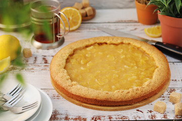 A tart with lemon marmalade served on the table