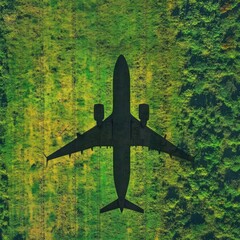 Aerial View of Passenger Airplane Flying Over Green Field; Top Down Angle; Commercial Flight; Travel Concept