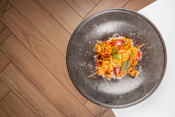 Pasta spicy tomato sauce with shrimp. Seafood, top view, copy space