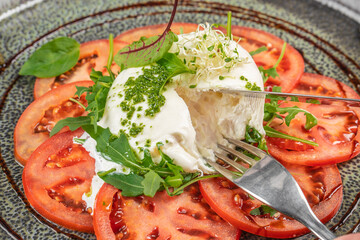 Salad Caprese with tomato, mozzarella and basil, copy space for text