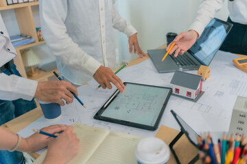 Business construction concept architect or engineer discussing with construction blueprint at...