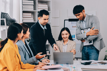 Team of financial advisory services. Asian advisor showing plan of investment to clients in the consultancy office..