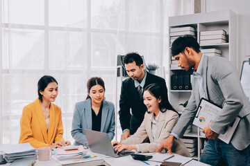 Team of financial advisory services. Asian advisor showing plan of investment to clients in the consultancy office..