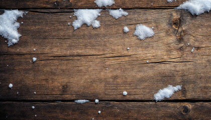 Snow-dusted vintage wood panel evokes a wintry atmosphere, showcasing the natural grain and texture under a delicate blanket of fresh snow.