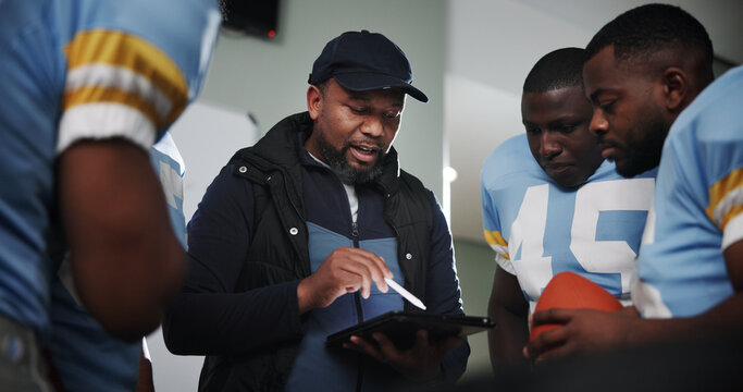 Tablet, coaching and football with team in locker room for game plan, sports strategy or defense formation. Touchdown tactics, match feedback and discussion with people and advice for training