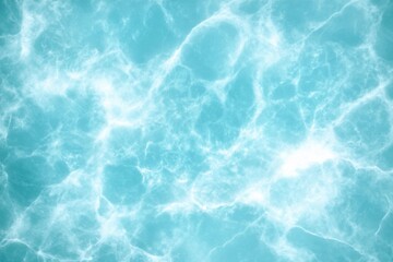 Obraz premium Abstract view of turquoise water with sun reflections and caustics from above in the caribbean