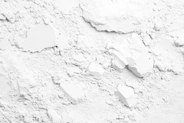 A textured surface of crumbled white powder.  Small, irregular fragments and crevices are visible