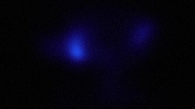 Black background with abstract dark blue neon light speckled grains, bright color gradient with soft texture