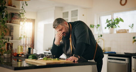 Cooking, fatigue and headache with man in kitchen of home for crisis, failure or mistake....