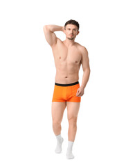 Fototapeta premium Young man in stylish orange underwear on white background