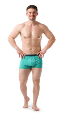 Fototapeta premium Young man in stylish turquoise underwear on white background