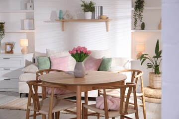 Stylish dining table with chairs in room. Interior design