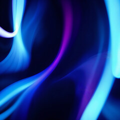 Naklejka premium A mesmerizing abstract swirl of vibrant blue and purple light dances across the dark space, creating a sense of fluid movement and ethereal beauty.