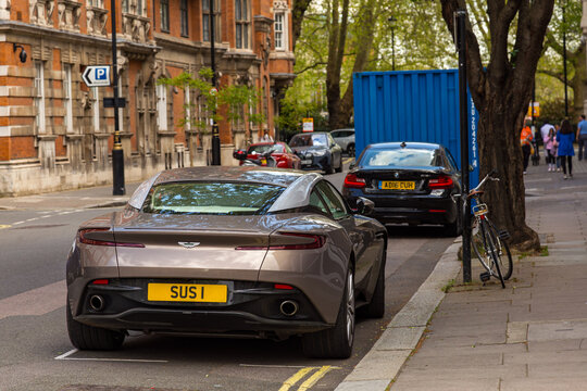 Aston Martin with Yellow License Plate 'SUSI' Spotted in London: A Stylish Display of British Automotive Design and Personalized Luxury on the City Streets