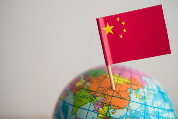 Close up Chinese flag marking at China geography on globe with white background copy space. China...