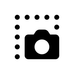 Black camera icon with a white lens surrounded by black dots on the top and left side arranged linearly