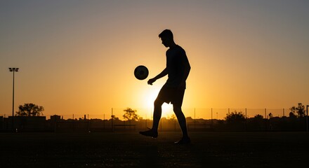 Silhouette of Player Juggling Ball at Sunrise