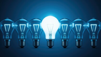 Illuminated Bulb Surrounded by Dim Bulbs Symbolizing Innovative Ideas and Bright Solutions