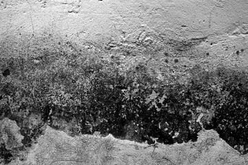 Grungy wall texture with cracks and mud.