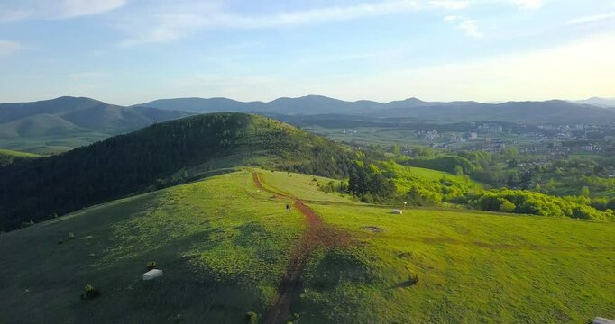 Aerial nature summer landscape flight over picturesque mountains forests meadows