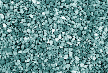 Pebble stones background in cyan tone.