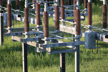 A tall power line pole with a lot of wires on it