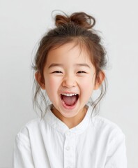 Joyful young girl laughing with happiness and excitement