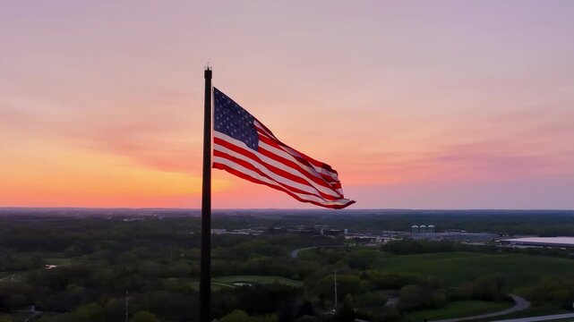 Largest flagpole in the USA displays a US flag at sunset