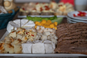 A plate of cheeses in detail.
