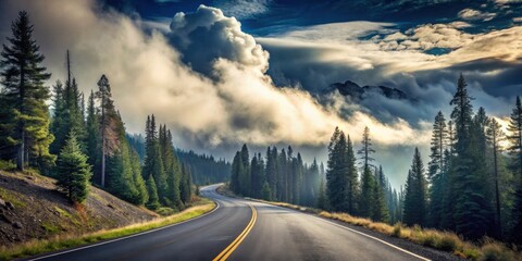 Scenic Highway Winding Through a Majestic Mountain Range, Enveloped in Misty Clouds at Sunrise
