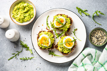Whole grain bread with avocado and boiled eggs.