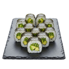 Freshly prepared sushi rolls with avocado and cucumber on a slate platter