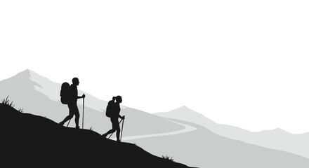 Obraz premium Two hikers trekking along a mountain trail in silhouette 
