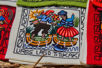 Traditional embroidery created by Uros artisans on the floating islands of Lake Titicaca, Puno, Peru. Rich in vibrant colors and symbolic motifs.