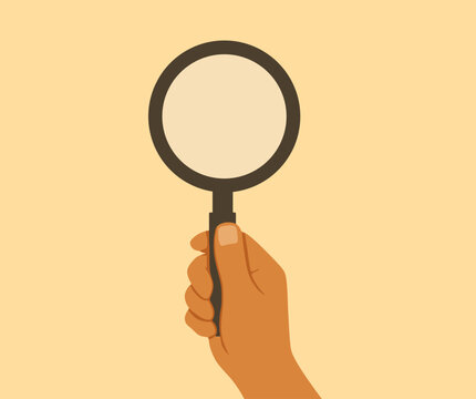 flat design hand holding magnifying glass