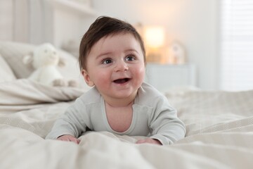 Bedtime. Cute little baby on bed at home