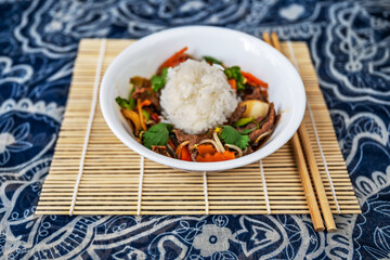 Sichuan meat with sliced vegetable and stewed rice.