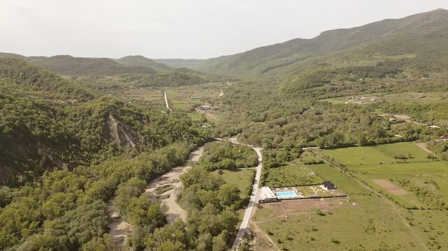 Aerial panorama highway road and Luxury Villa in Kakheti Region &ndash; Tranquil Retreat for Travel and Relaxation in the Heart of the Caucasus Mountains.Efficient Space Planning and Functional Architecture