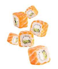 Levitation or flying of sliced homemade organic sushi rolls or maki made from fresh raw salmon fish, boiled rice, philadelphia cream cheese and avocado or cucumber slices isolated on white background