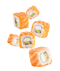 Fotobehang Sushi bar Levitation or flying of sliced homemade organic sushi rolls or maki made from fresh raw salmon fish, boiled rice, philadelphia cream cheese and avocado or cucumber slices isolated on white background  © Elena
